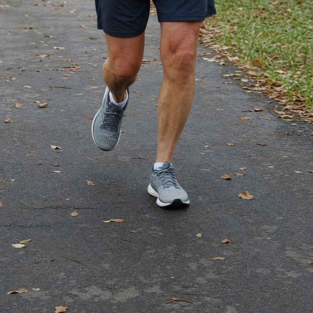 Close view of a runner's legs at an easy stride